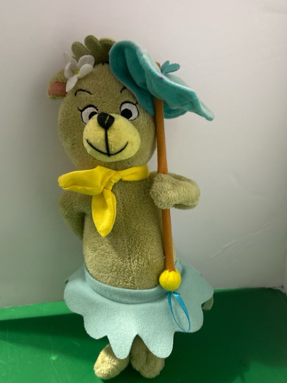 Green Flower Bear Plush with Yellow Scarf and Blue Skirt